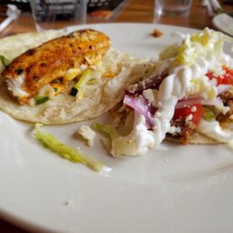 El Asador Steakhouse signature dishes Crispy Shrimp TacoSalmon al Horno